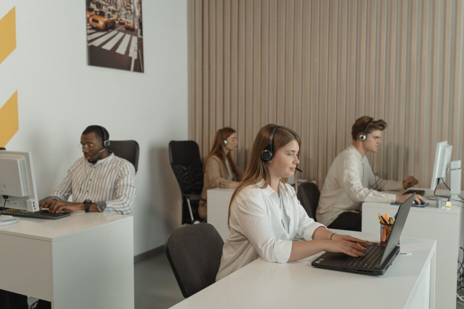 Woman in White Dress Shirt Sitting Beside Woman in White Long Sleeve Shirt